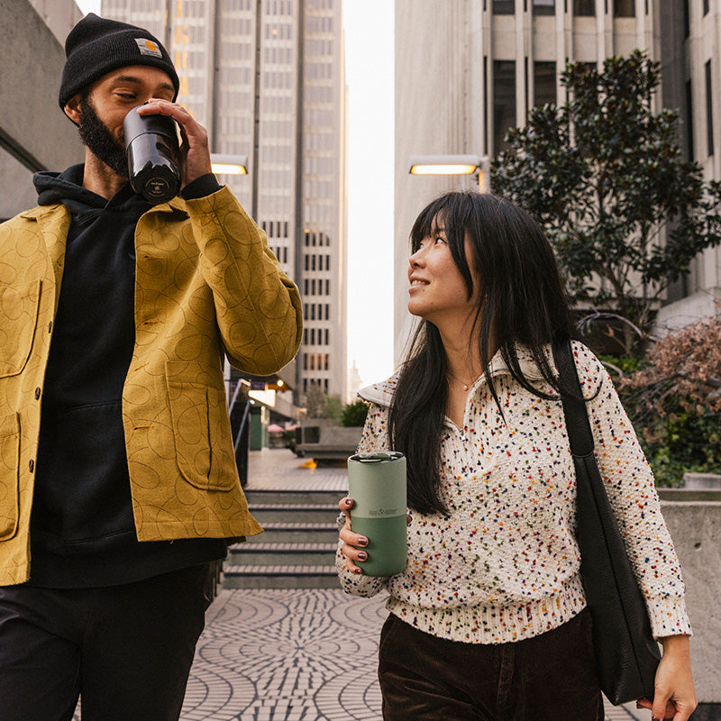 bring-your-own-party-kit-pints-and-tumblers-m3 16oz_rise_tumbler_black_iceberg_couple_drink_city_street_square.jpg