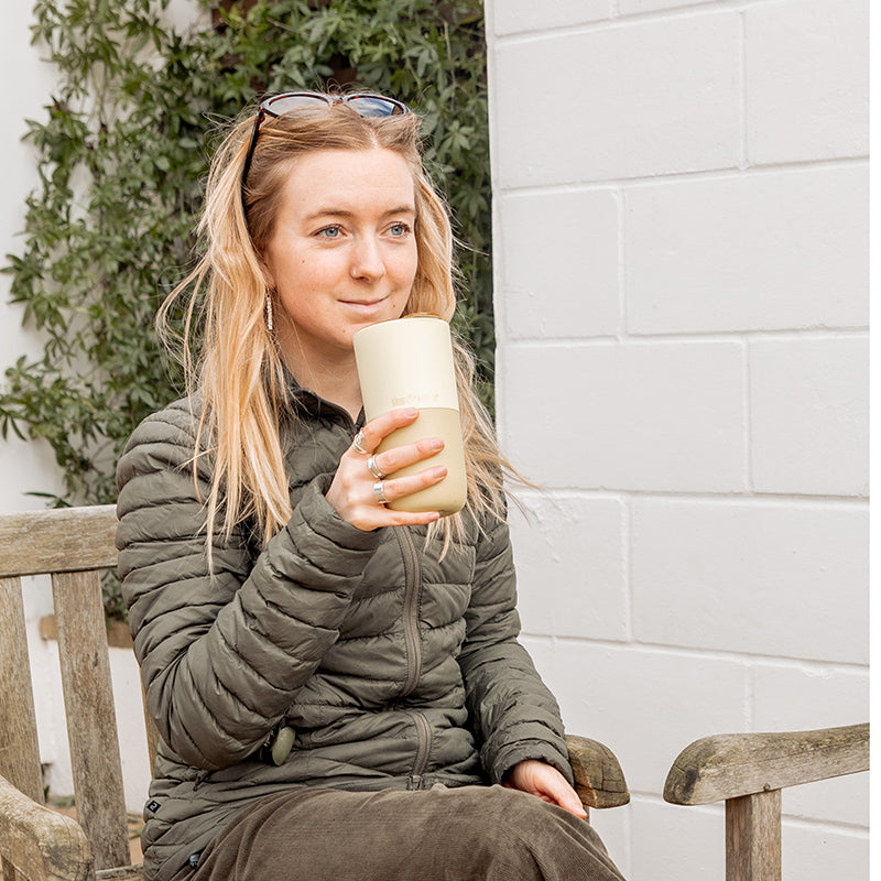 16oz-rise-tumbler-k4 16oz_rise_tumbler_wax_yellow_woman_seat_outside_square.jpg