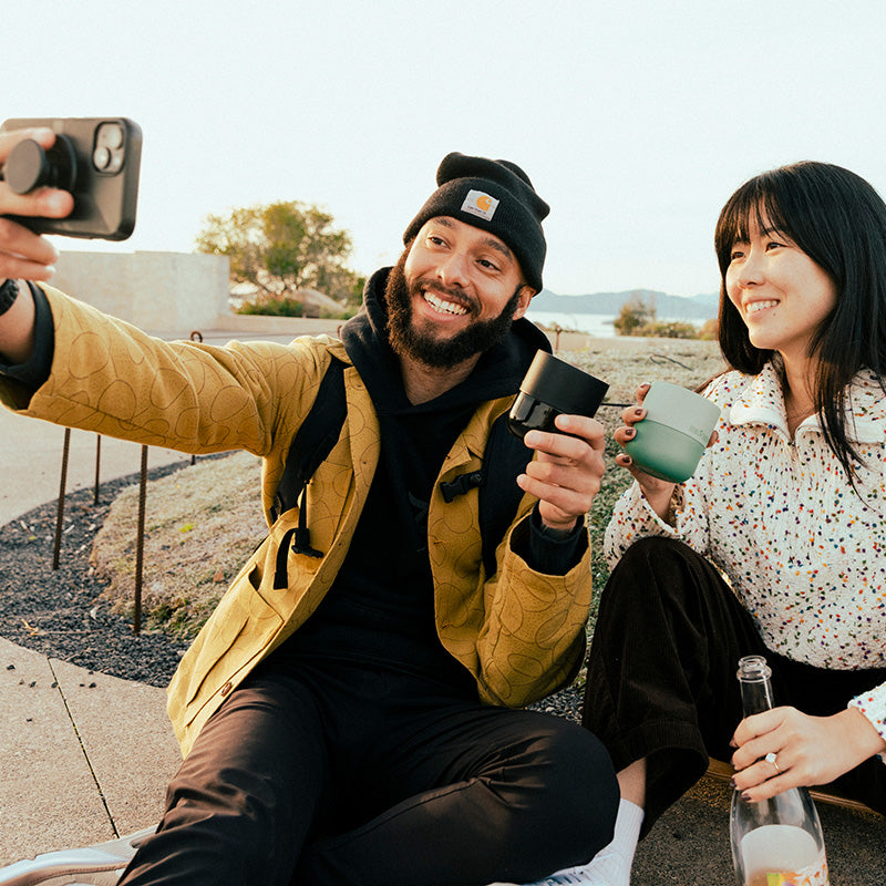 bring-your-own-party-kit-tumblers-and-cocktails-h3 8oz_rise_lowball_black_iceberg_couple_selfie_city_square.jpg