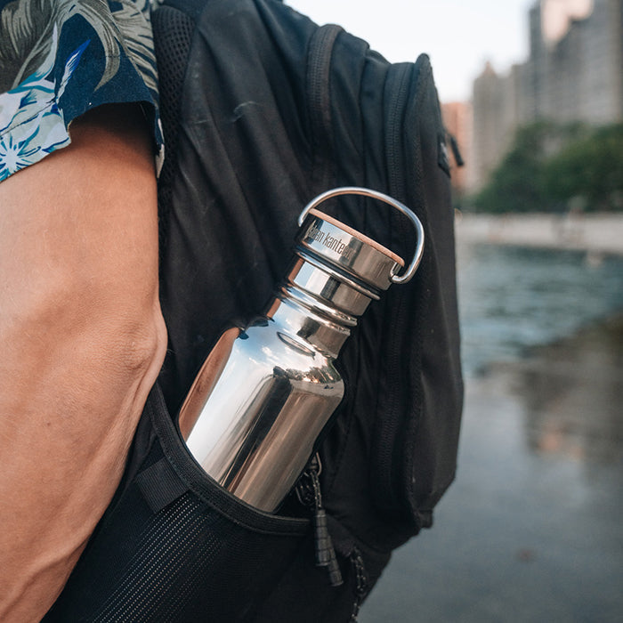 27oz-reflect-with-bamboo-cap-c5 K27SSLRF-MS-BAMBOO_reflect-bottle_backpack_lifestyle.jpg